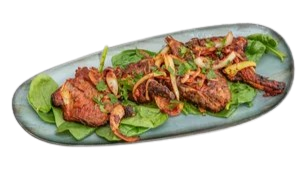 2 pieces. Served with salad. Meaty lamb chops steeped in ginger and chilli marinade, glazed on a griller.