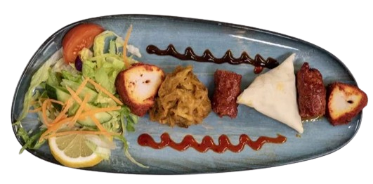 A combination of meat samosa, chicken tikka, seekh kebab, and onion bhaji.